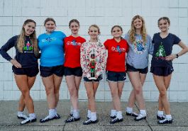  seven dancers pose for picture in one row