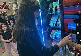  Student ordering book from vending machine